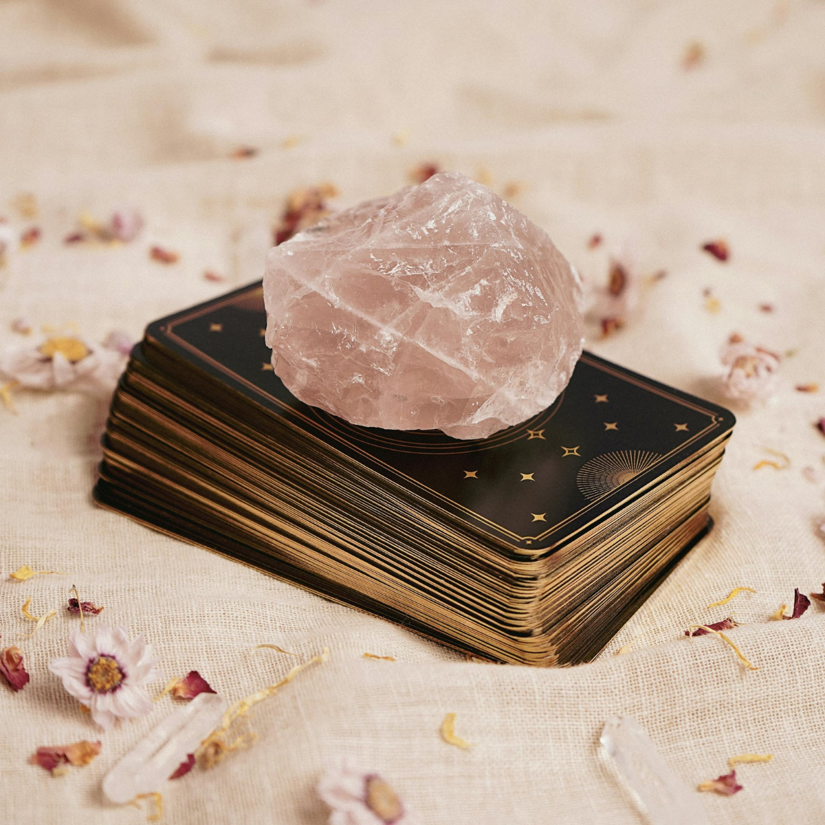 Rose quartz on tarot deck